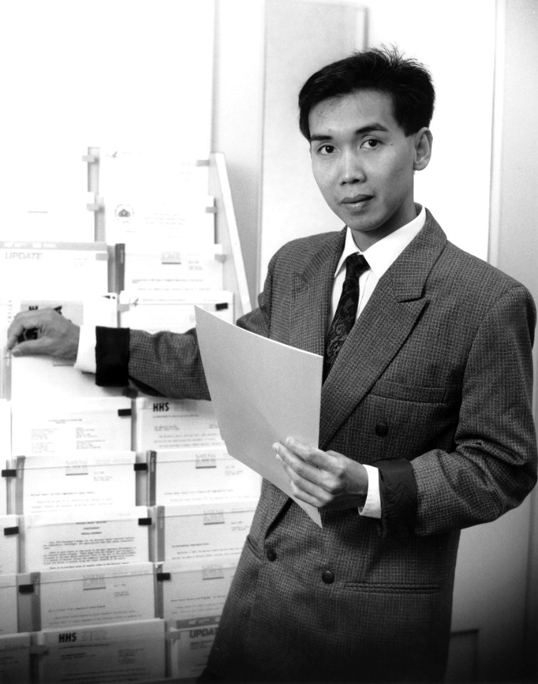 Man looking at booklets
