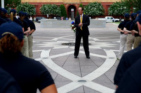 Man speaking to law enforcement explorers at the National Law Enforcement Officers Memorial photo