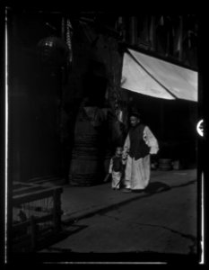 Man walking with a small child, Chinatown, San Francisco LOC agc.7a55097