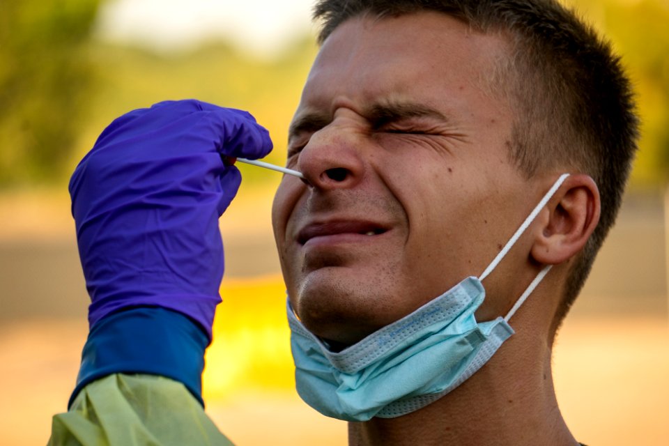 Man undergoes a COVID-19 swab test A