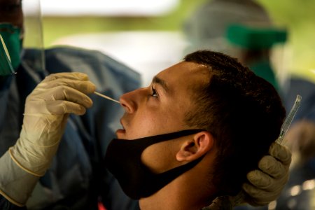 Man undergoes a COVID-19 swab test E