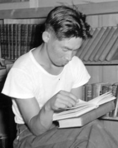 Male reading detail, from- Manzanar Relocation Center, Manzanar, California. A barrack building has been turned into a library . . . - NARA - 538175 (cropped)