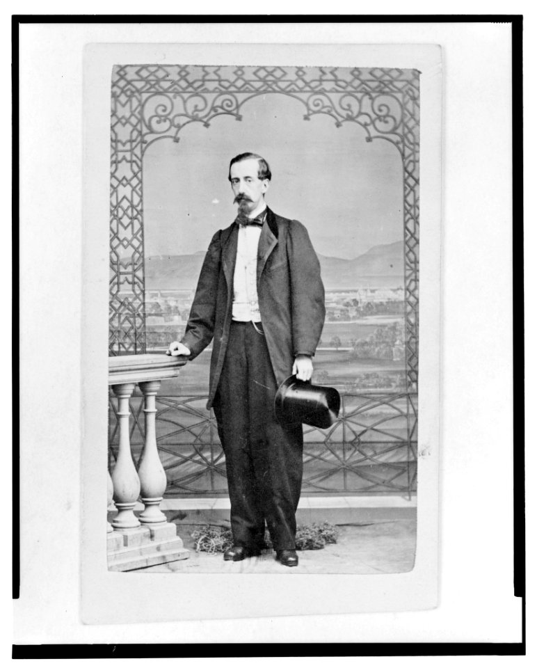 Man holding top hat, full-length portrait, standing, facing front LCCN2005681267