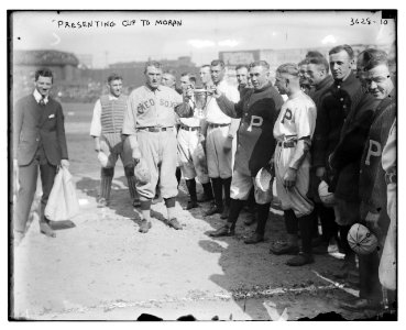 Managers Bill Carrigan, Boston AL & Pat Moran, Philadelphia NL holding ears of cup (baseball) LCCN2014700028