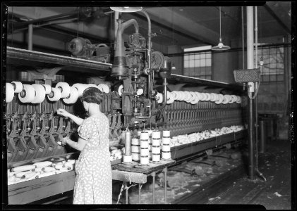 Manchester, New Hampshire - Textiles. Pacific Mills. Barber-Colman Automatic Spooler. Very modern. Looking from front... - NARA - 518749 photo