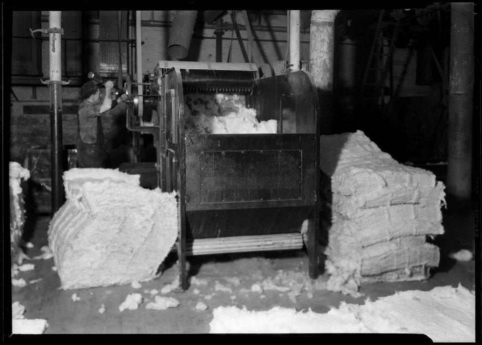 Manchester, New Hampshire - Textiles. Pacific Mills. Opener picker. Cotton from several bales of different grades... - NARA - 518738