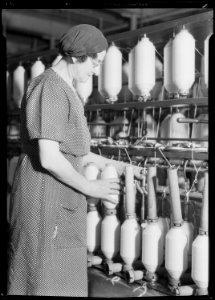 Manchester, New Hampshire - Textiles. Pacific Mills. Roving, a drawing-out process. (Front of machine). - NARA - 518746 photo