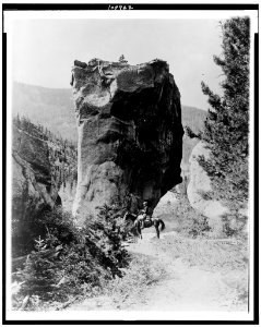 Man on horseback by butte in Rocky Mountain National Park, Colorado LCCN90715605