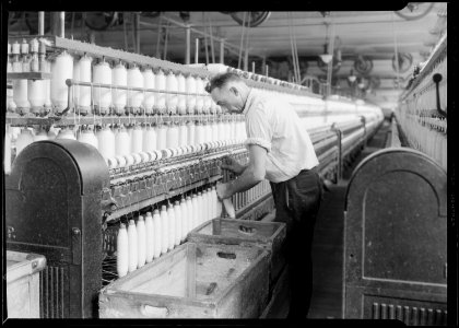 Manchester, New Hampshire - Textiles. Pacific Mills. Spinning, Doffing machine. - NARA - 518748 photo