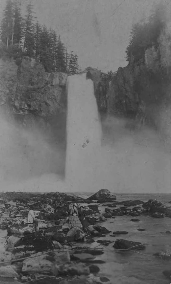Man painting a picture of two women in front of Snoqualmie Falls, probably between 1880 and 1889 (PEISER 229)