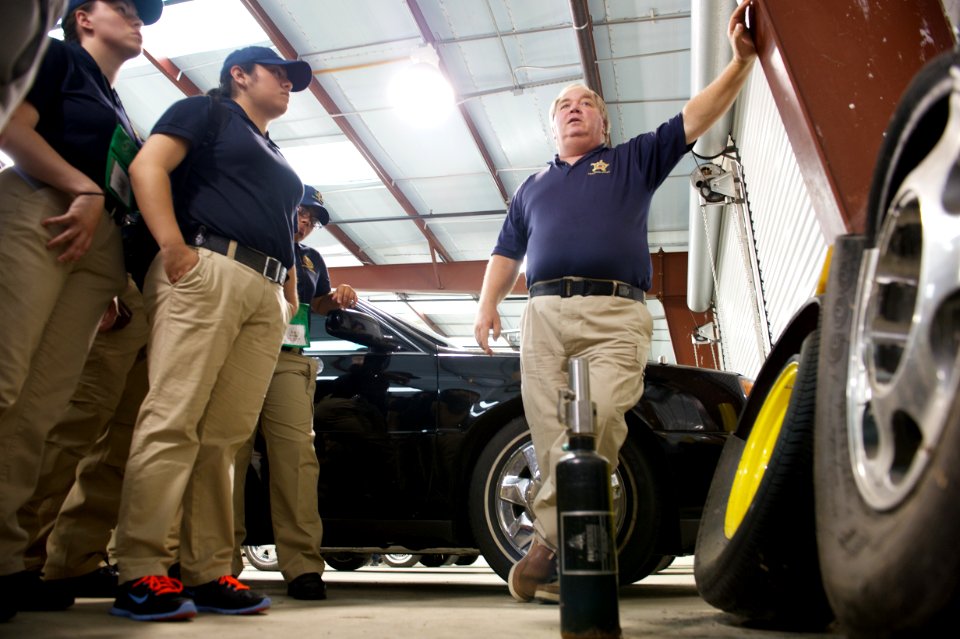 Man talks about vehicle fleet to law enforcement explorers