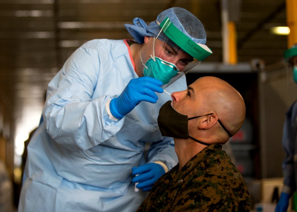 Man undergoes a COVID-19 swab test B