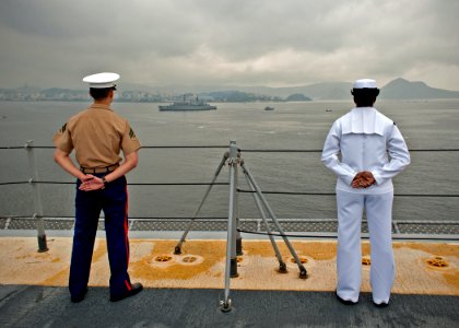 Manning the rails as USS America departs Rio De Janeiro 140809-N-FR671-086