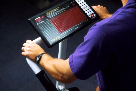 Man on stair machine photo