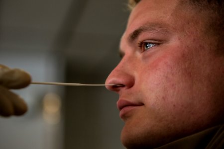 Man undergoes a COVID-19 swab test D