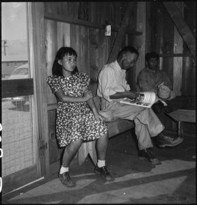 Manzanar Relocation Center, Manzanar, California. Evacuees waiting their turn to be called by the n . . . - NARA - 538150
