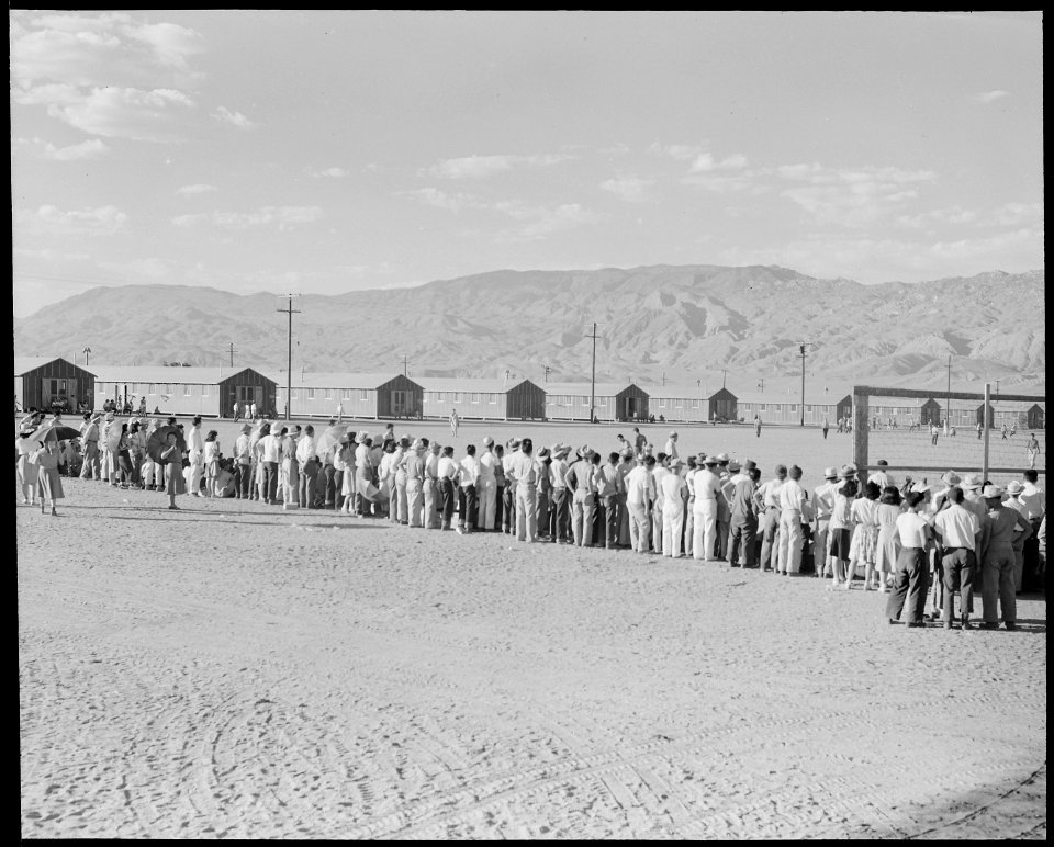 Manzanar Relocation Center, Manzanar, California. Evacuees watching a baseball game at this War Rel . . . - NARA - 538063