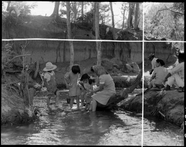 Manzanar Relocation Center, Manzanar, California. Evacuees enjoying the creek which flows along the . . . - NARA - 538087