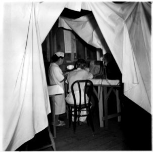 Manzanar Relocation Center, Manzanar, California. Making an examination of an evacuee patient are D . . . - NARA - 538140