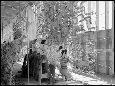 Manzanar Relocation Center, Manzanar, California. Making camouflage nets for the War Department. T . . . - NARA - 538107