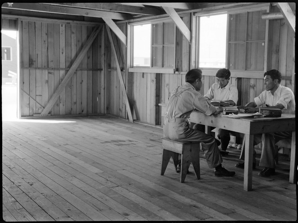 Manzanar Relocation Center, Manzanar, California. The staff of the Japanese language section of the . . . - NARA - 538166