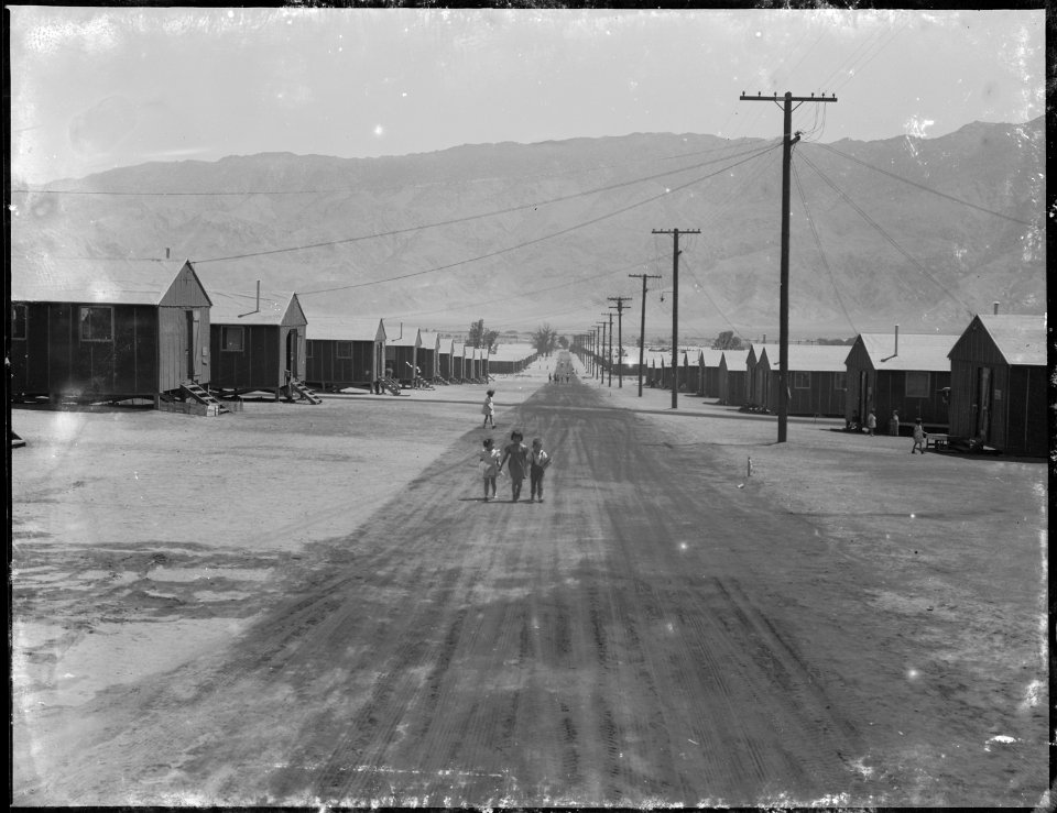 Manzanar Relocation Center, Manzanar, California. Street scene looking east toward the Inyo Mountai . . . - NARA - 538121