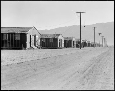 Manzanar Relocation Center, Manzanar, California. Street scene of barrack homes at this War Relocat . . . - NARA - 538126