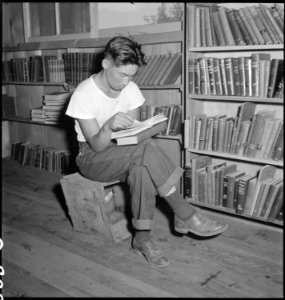 Manzanar Relocation Center, Manzanar, California. A barrack building has been turned into a library . . . - NARA - 538175