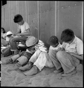 Manzanar Relocation Center, Manzanar, California. Young sixth-grade students studying their lessons . . . - NARA - 537957