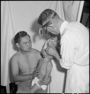 Manzanar Relocation Center, Manzanar, California. Doctor Takahashi, Eye, Ear, Nose and Throat Speci . . . - NARA - 538147