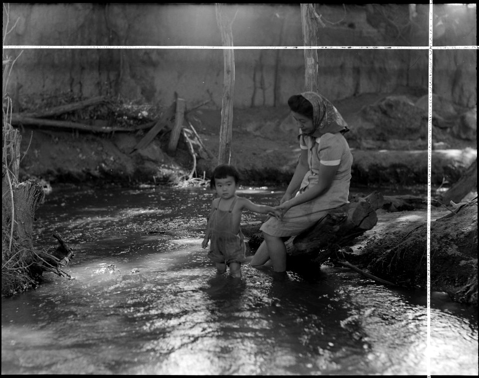 Manzanar Relocation Center, Manzanar, California. Evacuees enjoying the creek which flows along the . . . - NARA - 538086