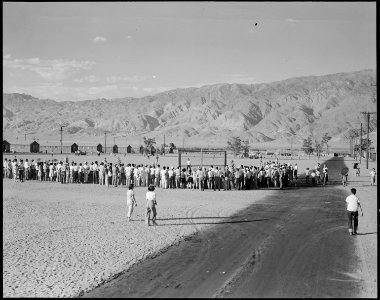 Manzanar Relocation Center, Manzanar, California. Evacuees watching a baseball game at this War Rel . . . - NARA - 538061
