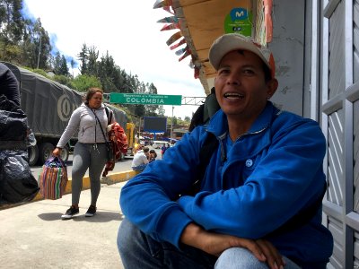 Marcos Camacaro, originally from Barquisimeto, Venezuela, sells coffee at the Rumichaca international bridge, on the border between Colombia and Ecuador, to the hundreds of passers-by