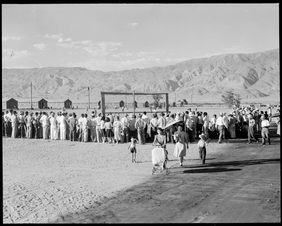 Manzanar Relocation Center, Manzanar, California. Evacuees watching a baseball game at this War Rel . . . - NARA - 538062