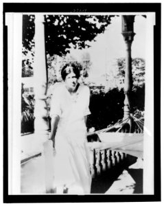 Marguerite Thompson Zorach, full-length portrait, sitting on a porch LCCN2007680356