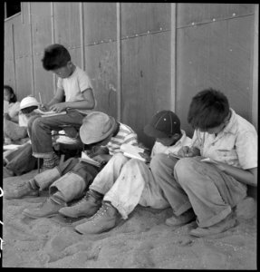 Manzanar Relocation Center, Manzanar, California. Young sixth-grade students studying their lessons . . . - NARA - 537957