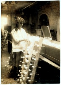 Margaret Ciampa, 14 years old, finishing flowers at Boston Floral Supply Co., 347-357 Cambridge Street. Said to be the only flower factory in Massachusetts. LOC nclc.05614
