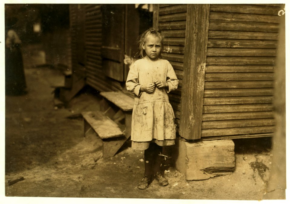 Marie Kriss, seven years old, shucks oysters and picks shrimp at Biloxi Canning Co., when not tending the baby. Makes 25 cents some days. LOC cph.3a01046