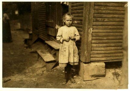 Marie Kriss, seven years old, shucks oysters and picks shrimp at Biloxi Canning Co., when not tending the baby. Makes 25 cents some days. LOC cph.3a01046