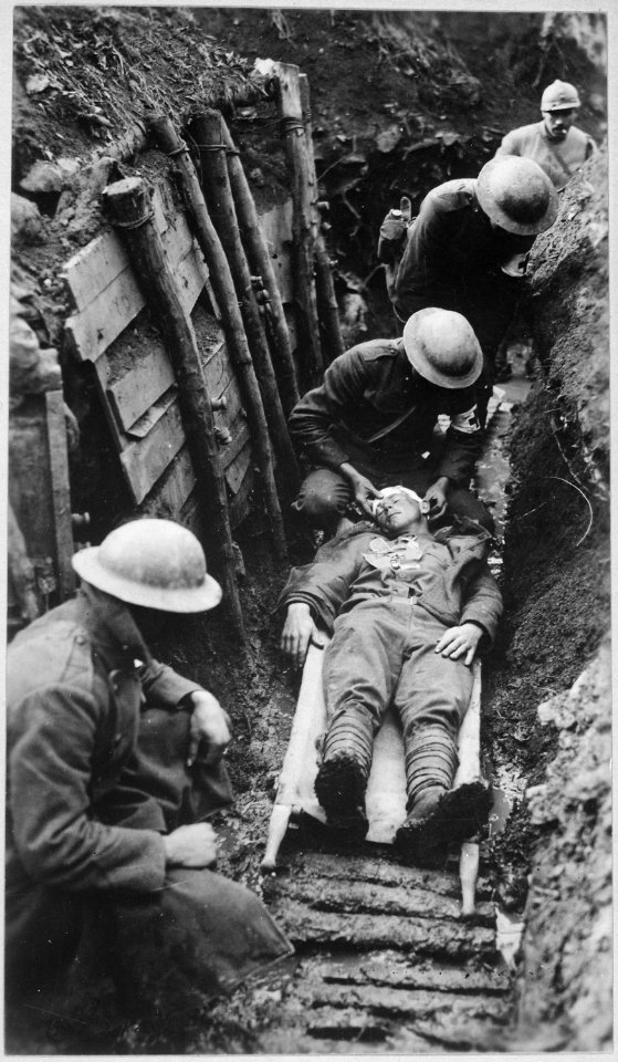 Marine receiving first aid before being sent to hospital in rear of trenches. Toulon Sector, France., 03-22-1918 - NARA - 530724