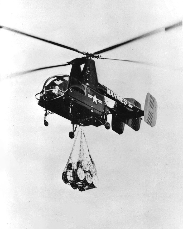 Marine OH-43D lifting fuel drums in 1956