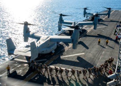 Marines board an MV-22 Osprey on the flight deck of the USS Makin Island. (28355648171)