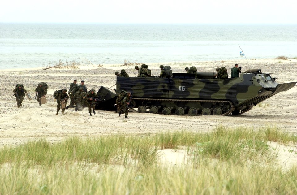 Marines disembark from an amphibious landing craft