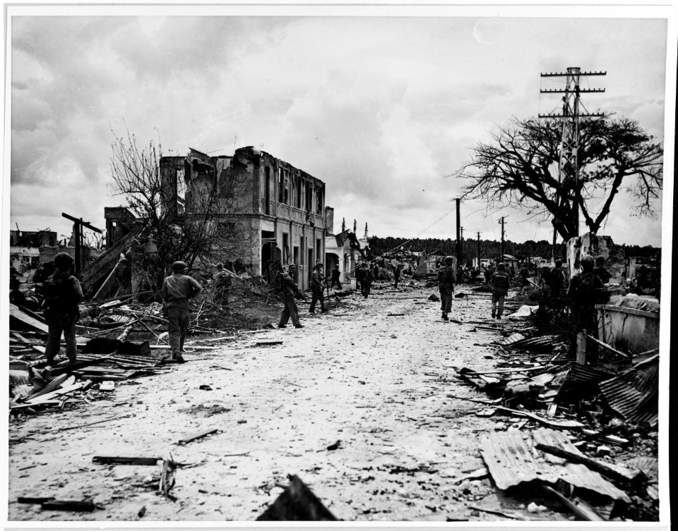 Marines enter the ruins of Hagåtña, Guam, on July 31, 1944