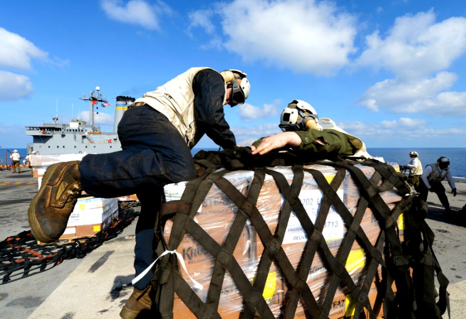 Marines unwrap cargo aboard USS Bonhomme Richard. (8467235717)