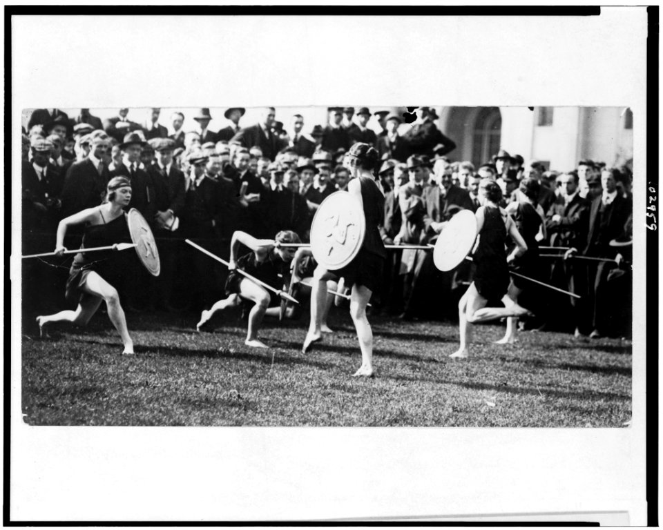 Marion Morgan's art dancers doing a pyrrhic dance, in Grecian costumes with shields, on the campus of Carnegie Institute of Technology, Pittsburg, Pennsylvania LCCN91728572
