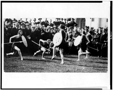 Marion Morgan's art dancers doing a pyrrhic dance, in Grecian costumes with shields, on the campus of Carnegie Institute of Technology, Pittsburg, Pennsylvania LCCN91728572