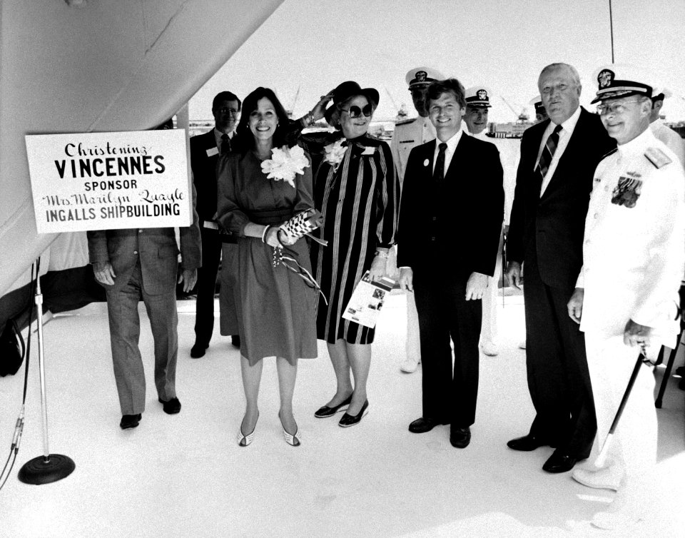 Marilyn Quayle stands with distinguished guests on the christening platform prior to christening the Aegis guided missile cruiser USS VINCENNES
