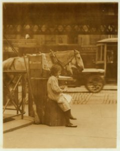 Minnie Paster, 10 years old. Tending stand at Bowery & Bond. LOC cph.3a21177
