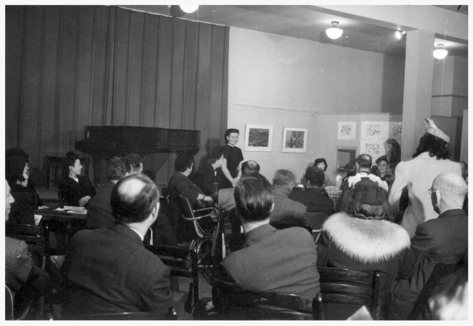 Miné Okubo is speaking at a tea in her honor (G-827)
